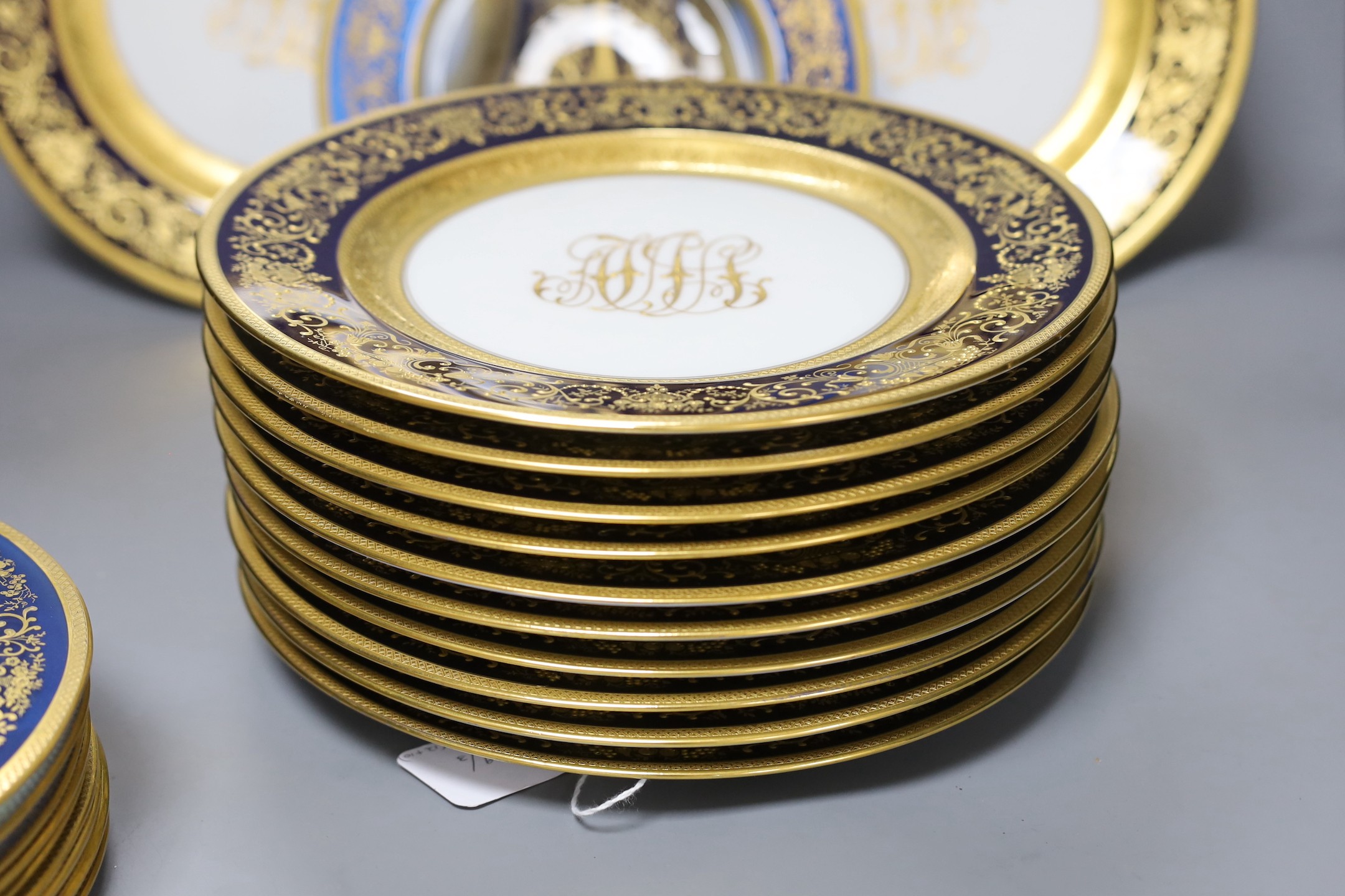 A set of 12 Hutschenreuther cabinet plates and a set of 10 gilded glass plates